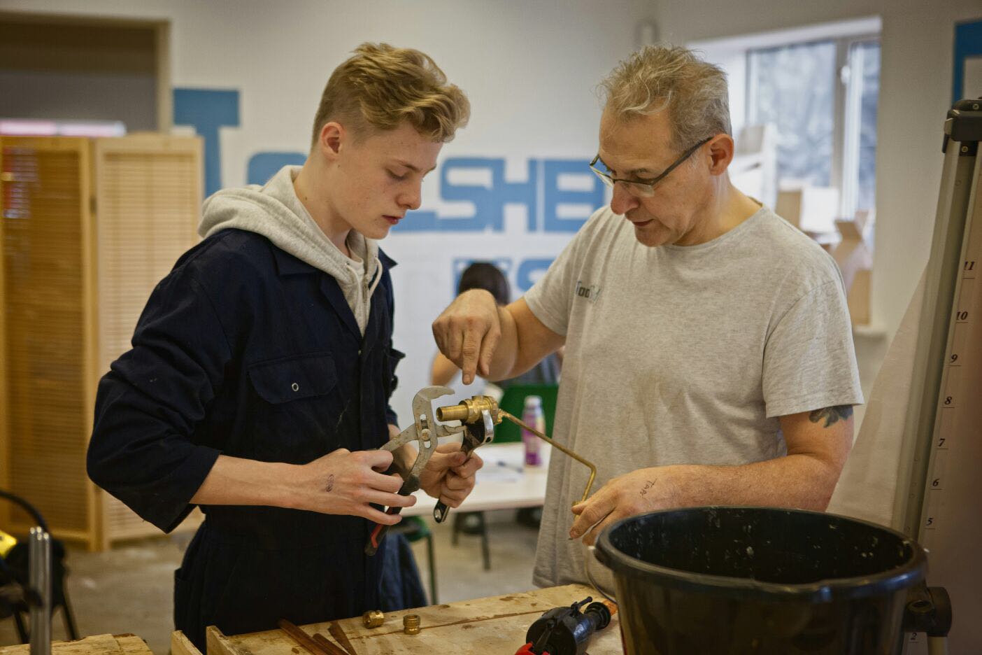 A student and teacher working at the Toolshed